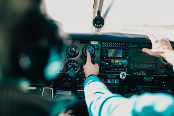 Flight instructor and student inside small Piper aircraft