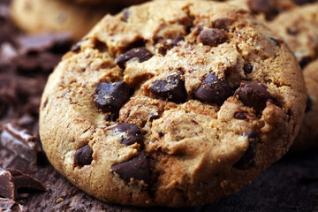 Chocolate cookies on wooden table. Chocolate chip cookies shot