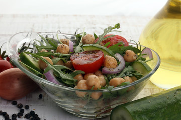 Healthy homemade chickpea and veggies salad, arugula, diet, vegetarian, vegan food, vitamin snack