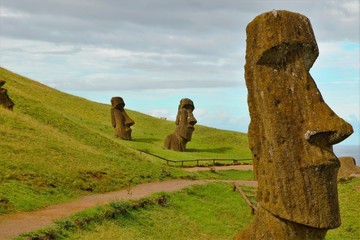 Long shot of Moai statues at the famous Moai statue quarry around the Rano Raraku volcano in Easter...