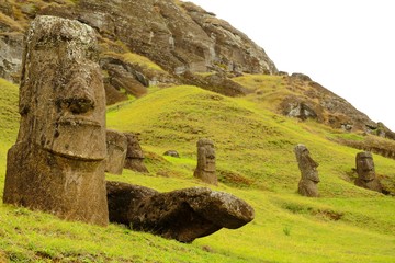 Long shot of Moai statues at the famous Moai statue quarry around the Rano Raraku volcano in Easter Island, Rapa Nui, Chile, South America