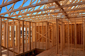 Wood framing members of new home under construction.