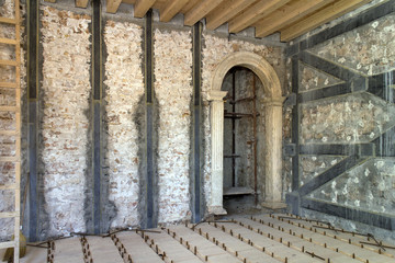 Renovation of old medieval house with injecting walls with special material and reinforcement with tapes of carbon fibers with special resin