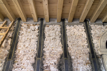 Renovation of old medieval house with injecting walls with special material and reinforcement with tapes of carbon fibers with special resin