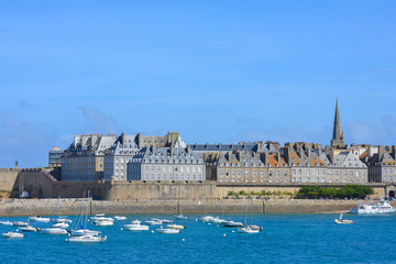 Saint-Malo, France, harbor in summer, boatd and blue sea - obrazy, fototapety, plakaty
