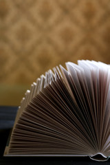 Room interior with black background and book