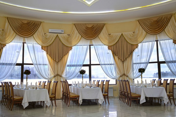 Interior of a cafe with the serviced tables
