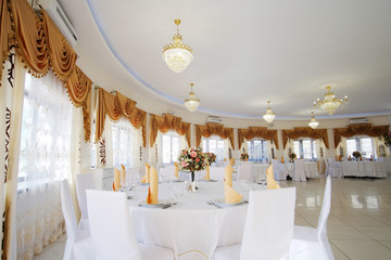 Interior of a cafe with the serviced tables