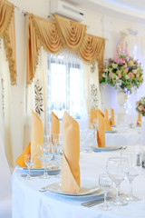 Interior of a cafe with the serviced tables