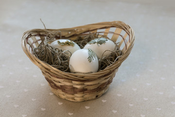 Easter basket on the sackcloth background