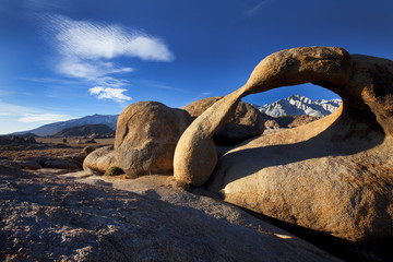 Natural arch in the Alabama Hills frames Mt. Whitney part of Sierra Nevada Mountains, near Lone Pine, California, USA