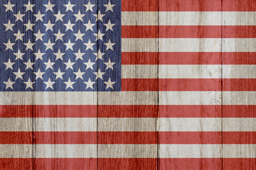 A rustic old USA flag on weathered wood