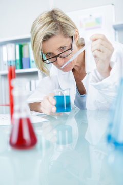 young female researcher carrying out experiments in a research lab