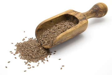 Flaxseeds in wooden scoop