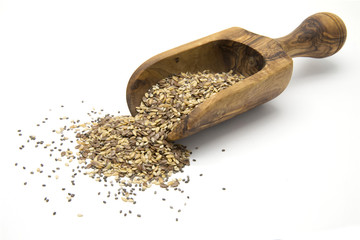 Flax, chia and sesame seeds in wooden scoop