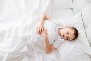 Fototapeta na wymiar Little boy child sleeping in bed