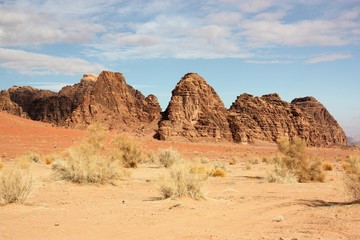 Fototapeta na wymiar Bizarre rock walls consisting of sandstone and granite in desert valley of Wadi Rum in Jordan