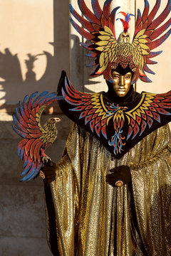 Precious golden costume showing power with gread eagle wings - Carnival in Venice