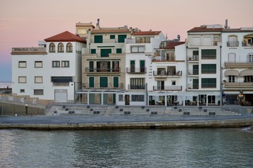 houses of a fishing village in the sundown