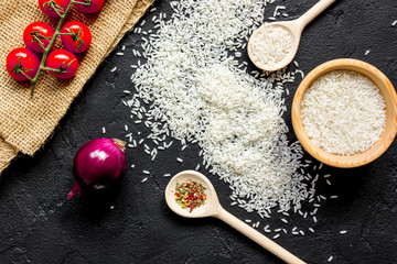 ingredients for paella on dark background top view