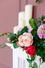 Little rose flowers on a white wooden table
