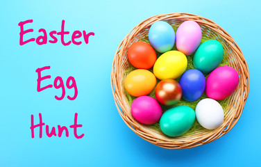 Easter eggs in nest on blue background