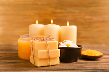 Spa composition with honey on wooden background