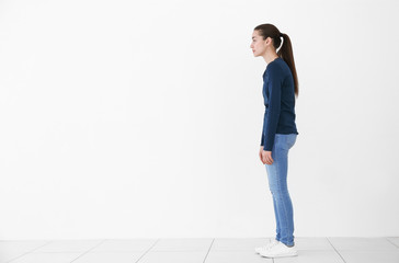 Posture concept. Young woman on white wall background