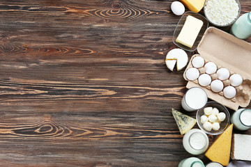 Obraz na płótnie Canvas Fresh dairy products on wooden background