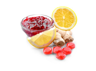 Fototapeta na wymiar Cough drops with lemon, ginger and jam on white background