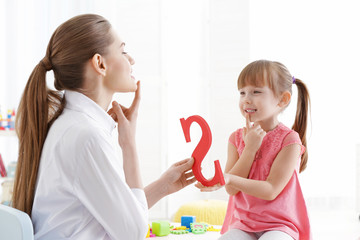 Cute little girl at speech therapist office