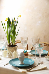 Beautiful Easter table setting with blue plate