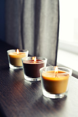 Cosy candles on an wooden table
