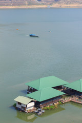 Ship sailing with houseboat at Mae Ngad dam in Chiangmai Thailand