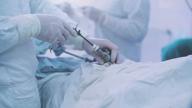 Surgeons performing surgery in operating Theater.