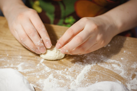 Woman preparing flour product - pie