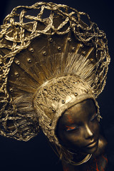 Mannequin in golden headwear