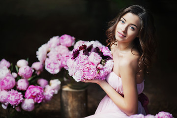 woman holding peony bouquet