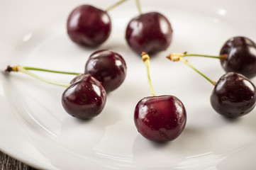 Close up of fresh cherry berries with water drops.
