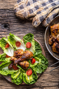 Grilled chicken legs lettuce and cherry tomatoes. Traditional cuisine. Mediterranean cuisine.