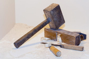 old plane and a chisel on a light background