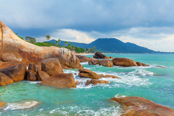 Azure sea and the red rocks of the island of Koh Samui in Thailand.