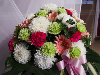 A flower bouquet with a lot of different flowers