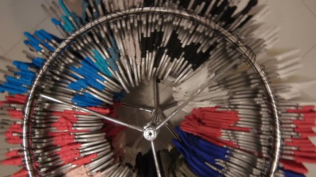 Upper View at Round Metal Clothes Hanger with Bright Color Dresses