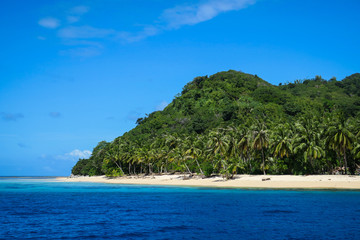 Fototapeta na wymiar Remote island beach for camping under the coconut trees
