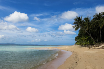 Puffy Clouds on Tropical Island Beach With Palm Trees - Linapacan, Palawan - Philippines