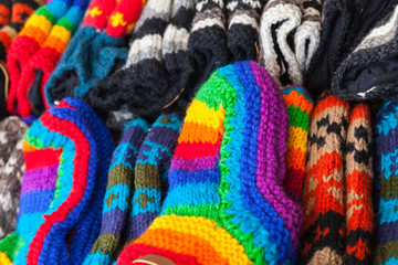 Colorful woolen socks lay on counter