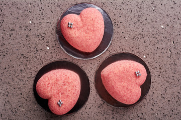 Pink heart-shaped cakes.