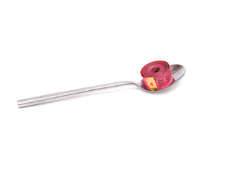 Diet concept.  spoon and measuring tape isolated on white