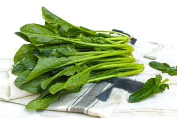 Fresh green Spinach leaves - diet and health concept